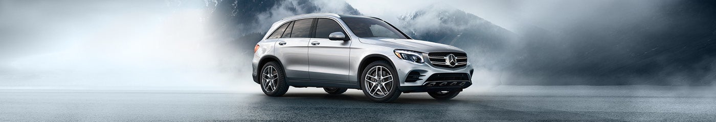 Mercedes-Benz GLC 300 parked on foggy mountain road